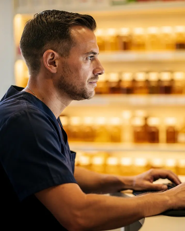 A staff member working through the morning fax inbox at a terminal